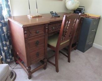 Old writing desk with 7 drawers and chair