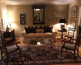 Lovely custom sofa in mint condition..
Antique chairs and mirror.  Beautiful Italian gilt sconces and fine German porcelains.  Custom made white brass traditional coffee table.