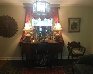 Stunning entry with antique bow front sideboard!