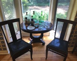 Old Victorian leather chairs and harp table
