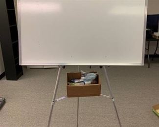 Adjustable easel with whiteboard and supplies