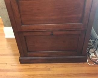 vertical wooden filing cabinet