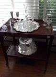 Tea cart with various American Brilliant Period cut glass, sterling and silver plate pieces.