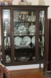 1940's china cabinet containing collection of American Brilliant Period cut glass pieces.