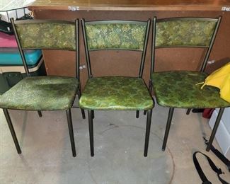 Three green retro chairs