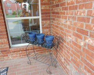 Iron plant stand and glazed pots