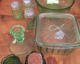 Green Depression Glass pieces:  salt and pepper sets, candle holder, two-piece vegetable dish,  medium bowl, toothpick holders.  $150.00