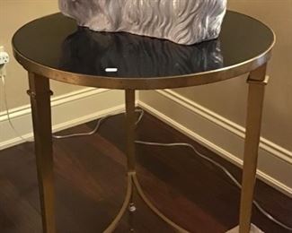 This sweet dog glazed in white is Italian $65 and the beautiful round stone and metal table $250