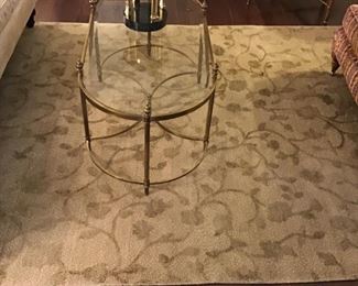 Brass and cocktail table $195 upon a hand knotted rug $550 6’ x 9’3”