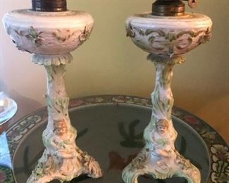 antique ceramic lamps with big bellies and little skinny arms