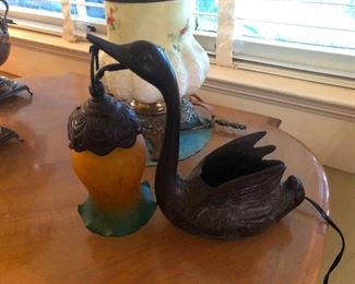 that swan is trying to eat that thing