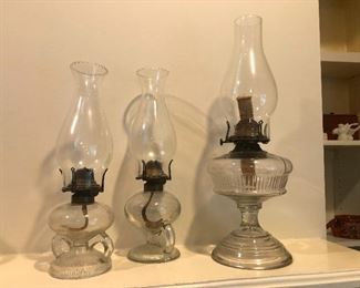 Hurricane lamps holding their heads up with tiny little arms