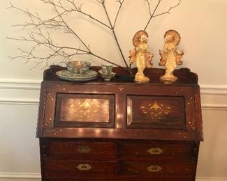 secretary desk with cool cracked wall behind