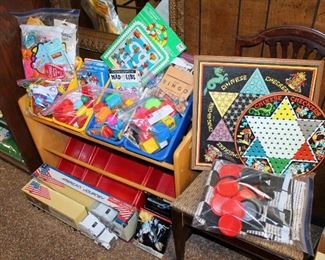 Toy storage rack, bag lots of toys, game board, and more!