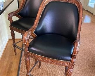 Pair of carved barstools.