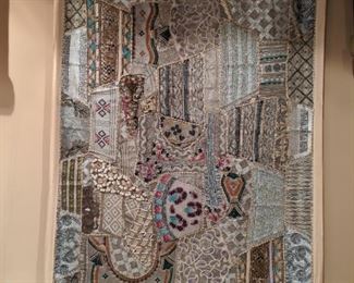 Interesting wall tapestry, hand-beaded and quilted together to make quite an MCM statement!