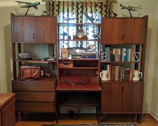 Vintage Yugoslavian teak wall unit.                                        One of the guys worked at Lockheed, for almost 40 years, so there's a lot of memorabilia spread around the house.