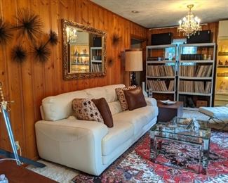 THIS is the forerunner of today's man-cave - The Sin Den of the Swingin' 60's baby!                                                           From the white leather *Sofitalia" couch, crystal chandeliers, Barcelona-inspired leather chairs, Persian Heriz rug, Pioneer surround sound system, hundreds of 33's & 45's, Playboy magazines and glass coffee table for all those perfectly inspired parties!