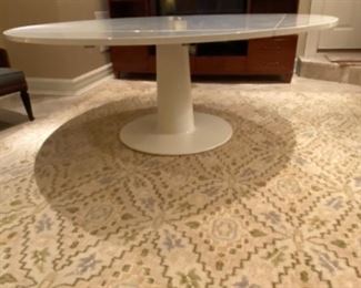 Polished 6' diameter Dining Table with pedestal base  and Beige/ Pattern Area Rug