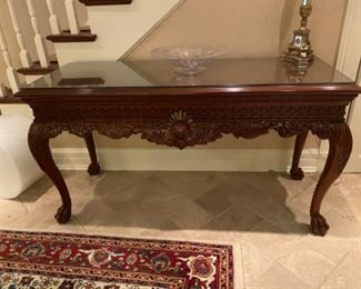 Intricate Cherry Wood Entryway Table with Lamp and Glassware