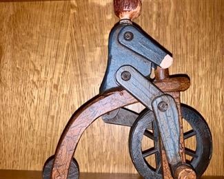 223. Folk Art Man on Bike Figurine (9" x 11")