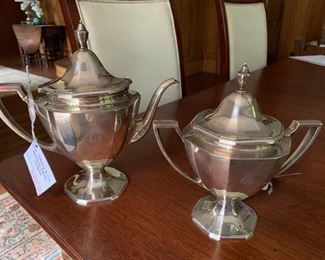 25a. Tiffany & Co. Sterling Silver Teapot 
25b. Tiffany & Co. Sterling Silver Sugar Bowl