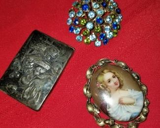 Sterling piece to the left and top and bottom right are costume jewelry
