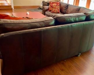 Lot 2100 $1,995.00 Bernhardt Warm Coffee Leather Sectional Sofa. Crafted with purposeful gradients of brown. Great Shape (curved corner). 2 pieces. Rolled Arms with Nailhead trim in a very fine buttery leather. Wooden Feet. Purchased at Walter E Smithe. Very Light signs of wear on the piping and cushions, but this could be intentional distress, and definitely no major issues are seen. 101" each side. x 39" deep x 40" h to back, 19.5" to seat cushion. Would fit in any style decor, family room, or rec room. Elegant. (Safe, throw pillows, and ottoman sold seperately)
