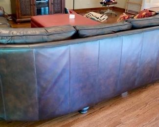 Lot 2100 $1,995.00 Bernhardt Warm Coffee Leather Sectional Sofa. Crafted with purposeful gradients of brown. Great Shape (curved corner). 2 pieces. Rolled Arms with Nailhead trim in a very fine buttery leather. Wooden Feet. Purchased at Walter E Smithe. Very Light signs of wear on the piping and cushions, but this could be intentional distress, and definitely no major issues are seen. 101" each side. x 39" deep x 40" h to back, 19.5" to seat cushion. Would fit in any style decor, family room, or rec room. Elegant. (Safe, throw pillows, and ottoman sold seperately)