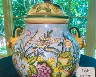 Lot 2123, $95.00 Large colorful covered urn with lion head handles. Lovely bird, floral, fruit & grape art design. Intentionally crackled glaze finish. Excellent condition. 20"T H x 18"W