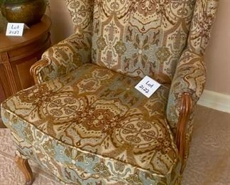 Lot 2122, $180.00 Upholstered, wingback chair with wood trim -upholstery in green, brown & cream tapestry 38" H x 30" W x 19"H floor to seat & chair seat is 20" D. Were this mine, I'd throw a couple of turquoise throw pillows on for pop! It's a well-crafted chair, and half-price!