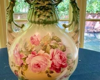 Lot 2128 $75.00 Vintage porcelain vase green and pink floral rose pattern. Signed "Austria" with artists mark. 14" H x 8" W Imagine the time and skill to paint roses on porcelain like this. Grab a piece of history, and buy now!!Or stash it away and give it as a fab gift for Christmas. It's got Class and Character!