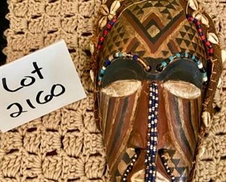 Lot 2160, $40.00. Vintage Mask with shells and beads from Zaire, Carved gourd African water carrier.