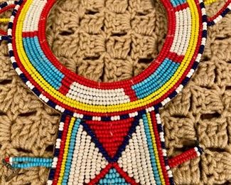 Lot 2161, $50.00. African beaded grouping (from Kenya): Large Beaded Necklace in multiple colors, 2 beaded necklaces, 2 beaded bracelets, and 1 beaded finger cap.