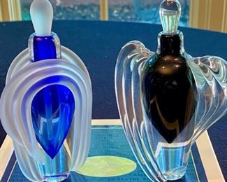 Lot 2145, $95.00. Two Art Glass Hand-Blown Perfume bottles, Cobalt Crystal signed Thomas Buechner - Both are 6.5"t x 4" w, Art Deco influence. This Lot would pair well with Lot 2553.