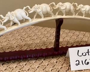 Lot 2163 $350.00 Carved Bone 'Elephant Parade', on carved wood base Stunning piece.