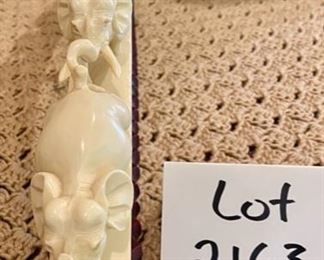 Lot 2163 $350.00 Carved Bone 'Elephant Parade', on carved wood base Stunning piece.