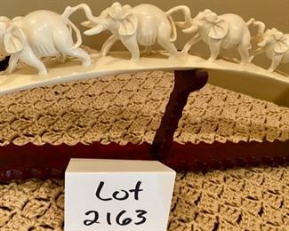 Lot 2163 $350.00 Carved Bone 'Elephant Parade', on carved wood base Stunning piece.
