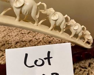 Lot 2163 $350.00 Carved Bone 'Elephant Parade', on carved wood base Stunning piece.
