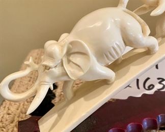Lot 2163 $350.00 Carved Bone 'Elephant Parade', on carved wood base Stunning piece.