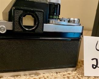 Lot #2168. $100.00. Vintage Nikon F 35mm Film Camera with Nikkor-S Auto Lens.