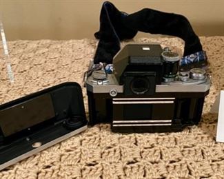 Lot #2168. $100.00. Vintage Nikon F 35mm Film Camera with Nikkor-S Auto Lens.