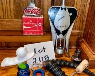 Lot 2118, $20.00 Barware tools, bottle stop by "Propaganda", Coca Cola bottle opener in box, "Barman" bottle opener and wine cork, 2 wood-handled corkscrew bottle openers,1 pourer & 3 Fizz-Wiz bottle caps