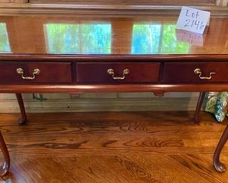 Lot 2146 $250.00 Hickory Chair Queen Anne Style Writing Desk 1. One bracket on the right needs to be repaired or replaced. 2. Some Wear on Desktop. 48" L x 17" D x 27.5" H Beautiful and graceful lines; a topnotch design.