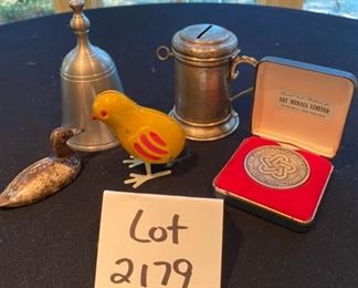 Lot 2179. $40.00. A random lot, but interesting. The silver handled cup/bank with a key is actually an antique Church Collection Cup that got passed around for parishioner's contributions. Also a pewter bell, a cast iron little duck decoy, a wind-up vintage chick, and a 1976 commemorative medal.