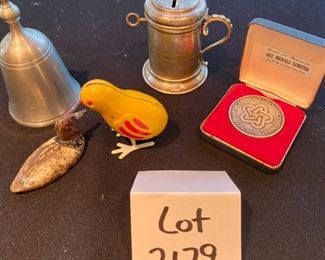 Lot 2179. $40.00. A random lot, but interesting. The silver handled cup/bank with a key is actually an antique Church Collection Cup that got passed around for parishioner's contributions. Also a pewter bell, a cast iron little duck decoy, a wind-up vintage chick, and a 1976 commemorative medal.