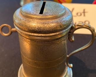 Lot 2179. $40.00. A random lot, but interesting. The silver handled cup/bank with a key is actually an antique Church Collection Cup that got passed around for parishioner's contributions. Also a pewter bell, a cast iron little duck decoy, a wind-up vintage chick, and a 1976 commemorative medal.