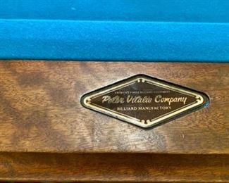 Lot 2169 Sunday Discounted Price: $700 FIRM. Was $975.00 Peter Vitale 8' professional pool table & accessories. Includes Pool cues, Set of Billiard Balls, Bridge, 15 and 8 Ball Racks, Chalk and Pool Cue Rack. Felt has been replaced within the last 2 years. Ask us about Delivery Services from one of our vendors. Typically $450.00 to break down and assembly at your home. Includes balancing of the pool table. (Rug is lot 2245).