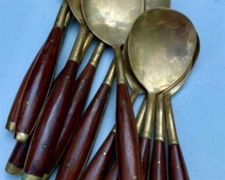 Lot 2175. $195.00. Vintage Brass with Rosewood Handled Flatware. 12 place settings; each setting has 11 pieces which include a steak knife, there are 12 additional serving pieces for a total of 144pcs. There is a storage box that is in rough shape but contains a storage area & covered drawer. Possible old Thailand/Siam flatware, not marked.