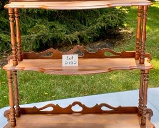 Lot 2182, $48.00. Antique, 3 tier wood shelf. Can rest on the floor or hang on the wall. Measures 33"W x 10" D x 27.5"H. Workmanship is top-notch!